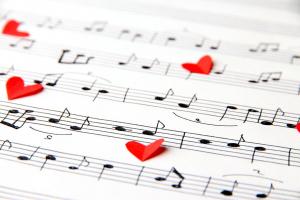 red-paper-hearts-on-music-sheets-300x200